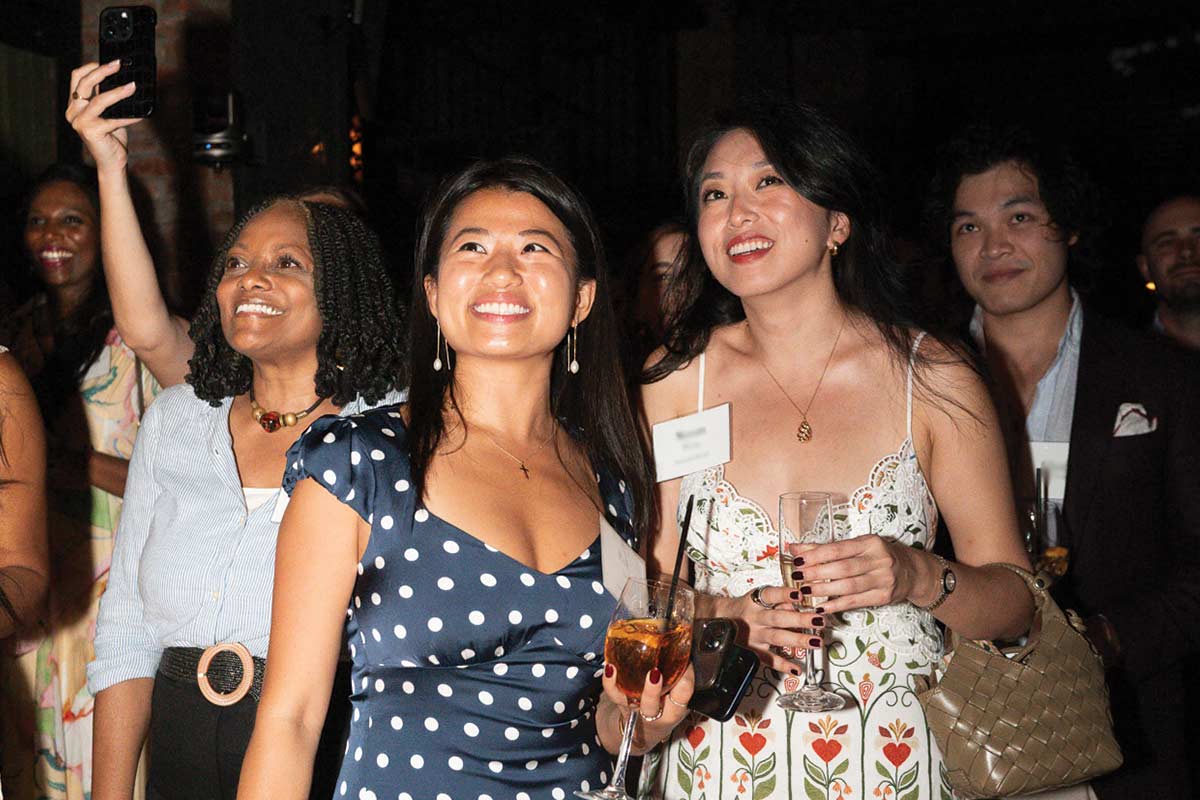 Guests smiling and looking up