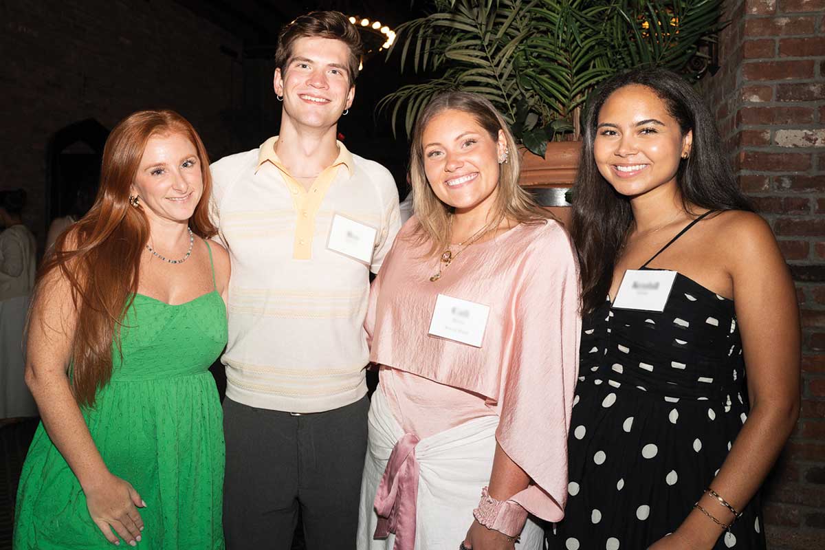 Four guests smiling